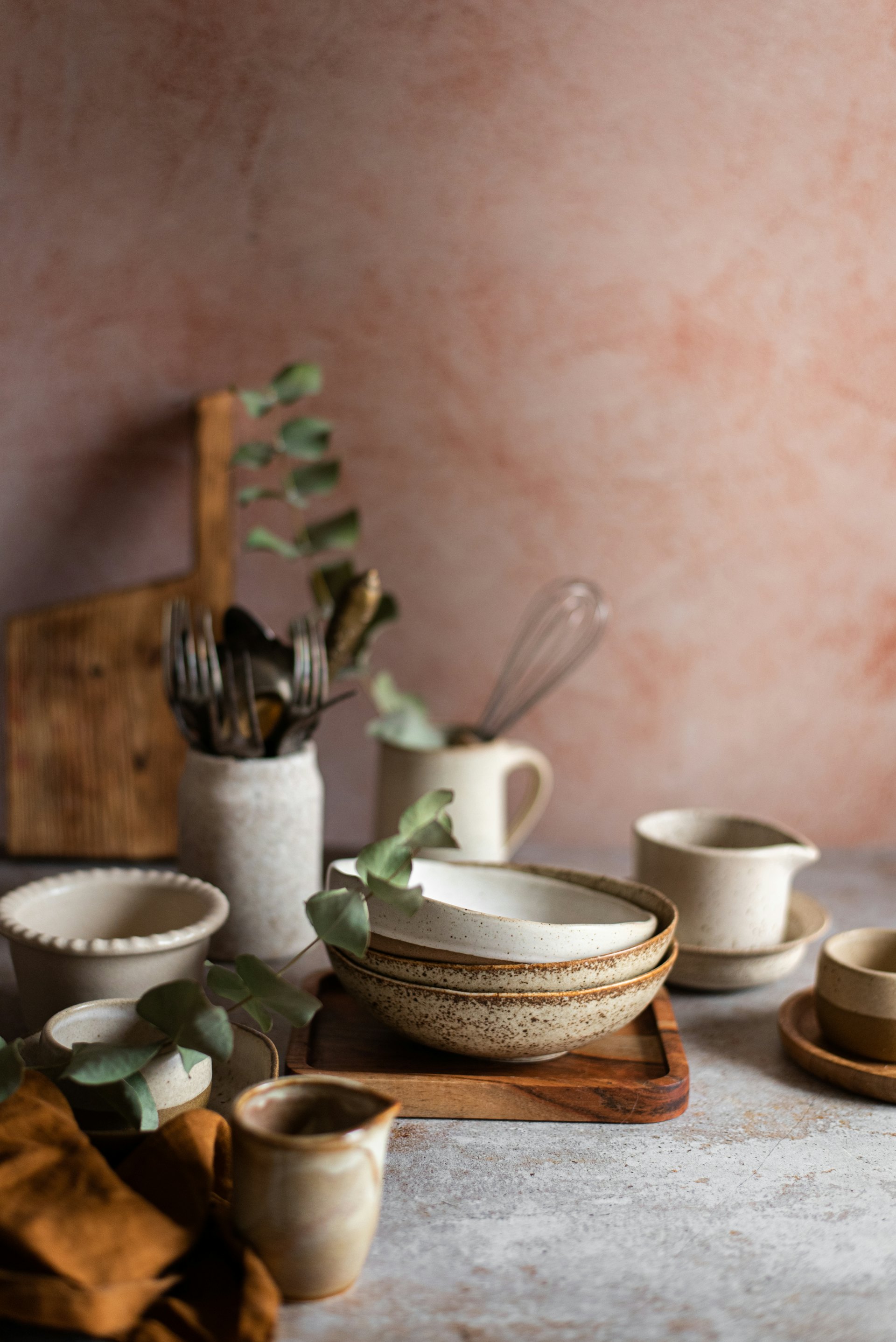 Ceramic bowls and cups arranged on a table